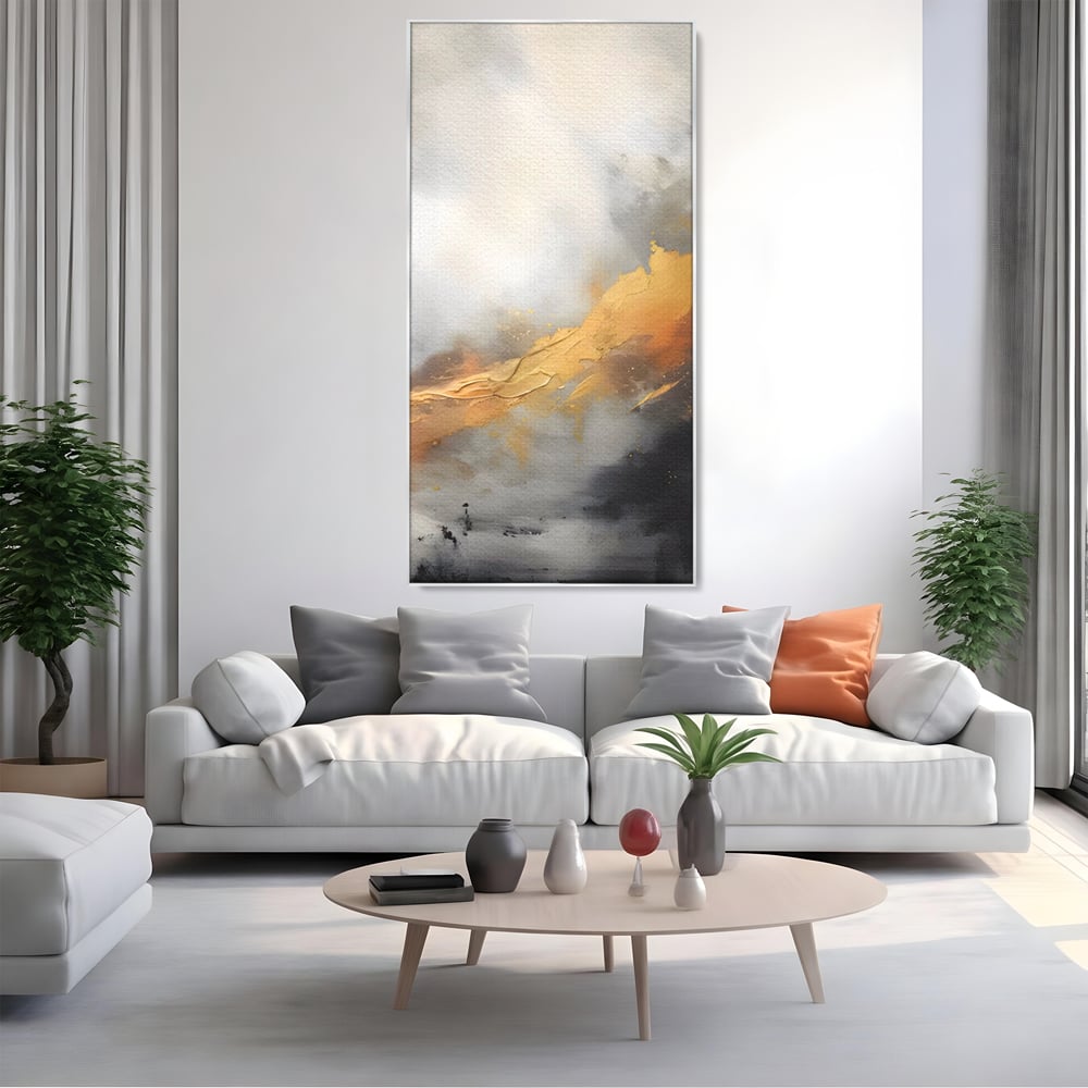 Tablou canvas cu pictura abstracta cu tusa aurie si tonuri gri, in rama de aluminiu argintiu, pe perete intr-un living